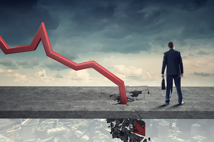 A man in a suit stands on a cracked platform as a large red arrow crashes through it, pointing downward, with a cityscape below.