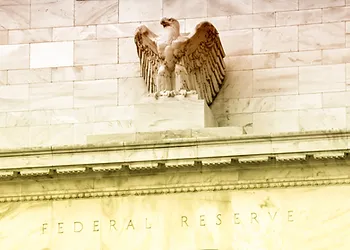 Stone eagle sculpture on the façade of the Federal Reserve building, with "Federal Reserve" engraved below.